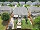Aerial view of backyard with outdoor living areas: patio, gazebo, garden, storage shed, and lawn at 5424 Tilley Manor Dr, Matthews, NC 28105