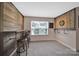 Cozy bonus room with decorative wood wall, bar, and dart board area at 5424 Tilley Manor Dr, Matthews, NC 28105