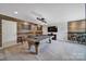 Spacious game room with a pool table, custom wood accents, and a bar area at 5424 Tilley Manor Dr, Matthews, NC 28105