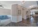 Bright hallway with hardwood floors, decorative molding, and an inviting open layout at 5424 Tilley Manor Dr, Matthews, NC 28105