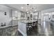 Stylish kitchen featuring an island with bar seating, modern cabinetry, and stainless steel appliances at 5424 Tilley Manor Dr, Matthews, NC 28105