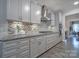 Beautiful kitchen with sleek cabinetry, stainless steel appliances, and stylish backsplash at 5424 Tilley Manor Dr, Matthews, NC 28105