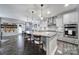 Bright, open kitchen boasts a large island, granite countertops, and stainless steel appliances at 5424 Tilley Manor Dr, Matthews, NC 28105