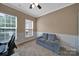 Bright office space with wainscoting, comfortable seating, and natural light at 5424 Tilley Manor Dr, Matthews, NC 28105