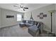 Comfortable sitting room featuring a plush sectional sofa and stylish decor at 5424 Tilley Manor Dr, Matthews, NC 28105