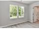 Bright bedroom with two large windows offering views of the outdoors at 560 Ridge Ave, Mooresville, NC 28115