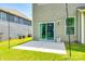 Backyard view featuring a sliding glass door to the home, concrete patio, and lawn at 5635 Agora Ct, Lancaster, SC 29720