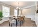 Dining area featuring hardwood floors, neutral walls, and natural light at 5635 Agora Ct, Lancaster, SC 29720