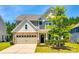 Charming two-story home with stone accents, inviting front entrance, and manicured landscaping at 5635 Agora Ct, Lancaster, SC 29720