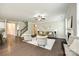Open-concept living room featuring hardwood floors, a fireplace, and lots of natural light at 5635 Agora Ct, Lancaster, SC 29720