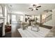 Open-concept living room and kitchen with hardwood floors and lots of natural light at 5635 Agora Ct, Lancaster, SC 29720