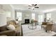 Bright and airy living room featuring hardwood floors, fireplace, and sliding glass door to the backyard at 5635 Agora Ct, Lancaster, SC 29720
