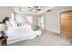 Spacious main bedroom with a tray ceiling leads to the ensuite bathroom and walk-in closet at 5635 Agora Ct, Lancaster, SC 29720