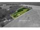 Scenic aerial view highlighting approximate property lines, a lush landscape, and surrounding trees at 5958 Hoover Elmore Rd, Lincolnton, NC 28092