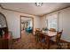 Cozy dining room with wooden table and chairs, and natural light, creates an inviting space for meals at 5958 Hoover Elmore Rd, Lincolnton, NC 28092