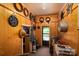 Inviting entryway decorated with wreaths, wooden walls, and vintage decor at 5958 Hoover Elmore Rd, Lincolnton, NC 28092