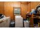 Functional laundry area with washer, dryer, storage shelves, and a bright window at 5958 Hoover Elmore Rd, Lincolnton, NC 28092