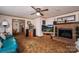 Comfortable living room with fireplace, TV, and ample seating, perfect for relaxation and entertainment at 5958 Hoover Elmore Rd, Lincolnton, NC 28092