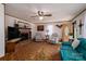 Cozy living room features a brick fireplace, comfortable seating, and ample natural light for relaxing at 5958 Hoover Elmore Rd, Lincolnton, NC 28092