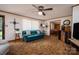 Inviting living room with cozy seating, carpeted floors, and bright windows offers a comfortable space at 5958 Hoover Elmore Rd, Lincolnton, NC 28092