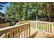 New wooden deck offers a serene outdoor space with views of the lush backyard at 6127 Eagle Peak Dr, Charlotte, NC 28214