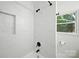 Elegant bathroom with marble tile shower, matte black hardware, and large window providing natural light at 6127 Eagle Peak Dr, Charlotte, NC 28214
