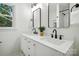 Elegant bathroom featuring a double sink vanity, quartz countertops, and modern matte black fixtures at 6127 Eagle Peak Dr, Charlotte, NC 28214