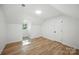 Clean bedroom with wood floors, dormer window, and closet at 6127 Eagle Peak Dr, Charlotte, NC 28214