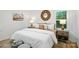 Cozy bedroom features a large bed, wood-framed mirror, and side tables with lamps at 6127 Eagle Peak Dr, Charlotte, NC 28214