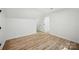 Neutral bedroom features wood floors, bright walls, and a closet at 6127 Eagle Peak Dr, Charlotte, NC 28214