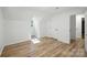Bright bedroom with hardwood floors, featuring dormer windows and closet space at 6127 Eagle Peak Dr, Charlotte, NC 28214
