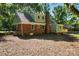 Rear exterior of brick and siding home showing well-maintained yard and mature shade trees at 6127 Eagle Peak Dr, Charlotte, NC 28214