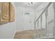 Inviting foyer with wood-look flooring, a decorative front door and staircase at 6127 Eagle Peak Dr, Charlotte, NC 28214