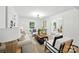 Bright living room with modern decor, hardwood floors, open to the kitchen and dining room at 6127 Eagle Peak Dr, Charlotte, NC 28214