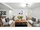 Bright living room with modern decor, hardwood floors, and neutral colors at 6127 Eagle Peak Dr, Charlotte, NC 28214