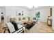 Bright living room with modern decor, hardwood floors, with lots of light at 6127 Eagle Peak Dr, Charlotte, NC 28214