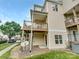 Backyard with a wood deck and balcony, surrounded by lush greenery and ample outdoor space at 7130 Founders Club Ct, Charlotte, NC 28269