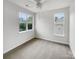 Bedroom featuring plush carpeting, large windows, and ample natural light at 7130 Founders Club Ct, Charlotte, NC 28269