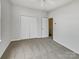 Large carpeted bedroom with ceiling fan and closet space perfect for storage and comfort at 7130 Founders Club Ct, Charlotte, NC 28269