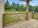 Spacious deck with wood railing offering a peaceful outdoor view at 7130 Founders Club Ct, Charlotte, NC 28269