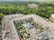 Aerial view showcasing a building with a central courtyard featuring a pool and landscaped gardens at 720 Governor Morrison St # 219, Charlotte, NC 28211