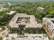 A high-angle view of a brick apartment complex with a central courtyard, landscaping and a pool at 720 Governor Morrison St # 219, Charlotte, NC 28211