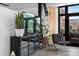 Cozy seating area with TV that features a plant and balcony access with outdoor views at 720 Governor Morrison St # 219, Charlotte, NC 28211
