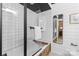 Bright bathroom featuring a white subway tile shower and shiplap accent walls at 720 Governor Morrison St # 219, Charlotte, NC 28211