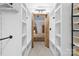 Spacious walk-in closet with custom shelving that leads to a cozy bedroom at 720 Governor Morrison St # 219, Charlotte, NC 28211