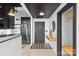 Welcoming entryway featuring a wooden console table, decorative light fixture, and modern finishes at 720 Governor Morrison St # 219, Charlotte, NC 28211