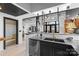 Stylish kitchen with black cabinets, steel appliances, quartz counters, and an open concept layout at 720 Governor Morrison St # 219, Charlotte, NC 28211