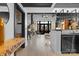 Modern living room featuring an open floor plan, hardwood floors, and access to a balcony with a neighborhood view at 720 Governor Morrison St # 219, Charlotte, NC 28211