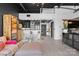 Open concept living room with modern furnishings, decor, and dark accent wall at 720 Governor Morrison St # 219, Charlotte, NC 28211