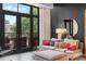 Bright living room with a comfortable sofa, balcony access, and large windows, creating a cozy and inviting space at 720 Governor Morrison St # 219, Charlotte, NC 28211